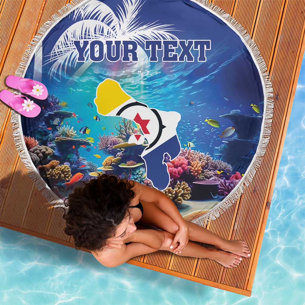 Round blue beach blanket with coral-fish print, 'YOUR TEXT' text, white fringe border