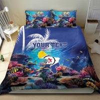 Blue coral reef bedding set on bed; sea fish scene with palm leaves and personalized text