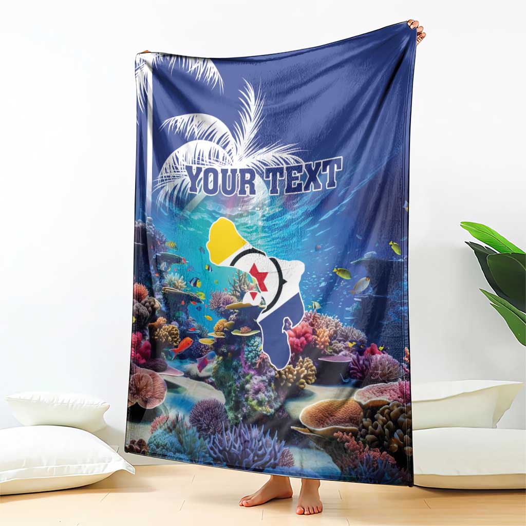 Blue coral reef blanket held up, fish and corals with 'YOUR TEXT' custom print