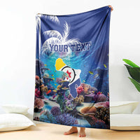 Blue coral reef blanket held up, fish and corals with 'YOUR TEXT' custom print