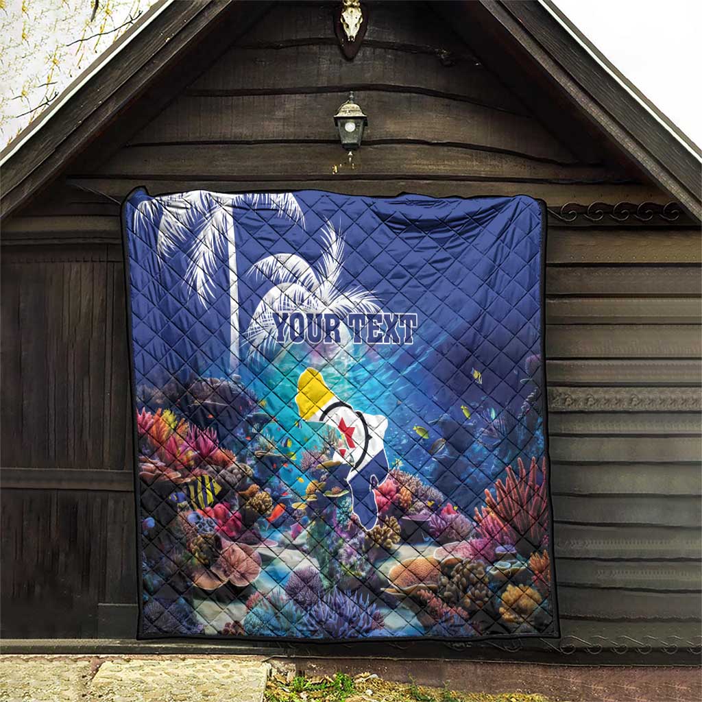 Blue personalized coral reef quilt with sea fish, custom text, hung indoors for display