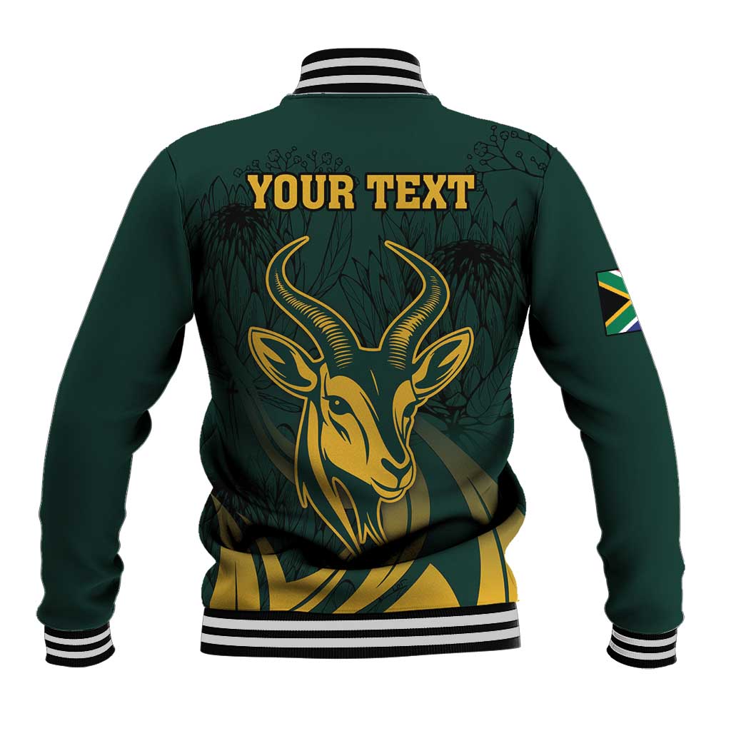 Green baseball jacket back with gold springbok graphic and “YOUR TEXT” print