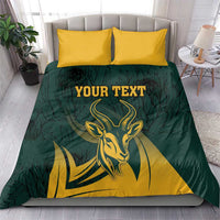 Springbok bedding set with green duvet, yellow pillows, and “YOUR TEXT” text