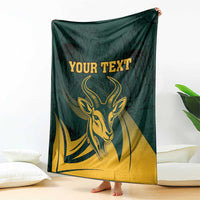 Hanging green South Africa personalized blanket with gold springbok head and protea leaf pattern