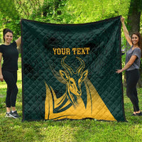 Green quilt blanket with yellow springbok design and customizable text