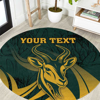 Round green carpet close-up of gold springbok face and "YOUR TEXT" lettering