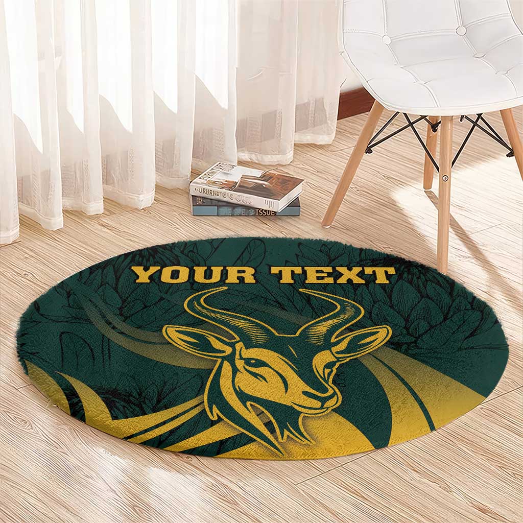 Round green carpet with gold springbok graphic and large "YOUR TEXT" banner