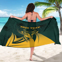 Green sarong worn as wrap with springbok flag print and 'YOUR TEXT' text