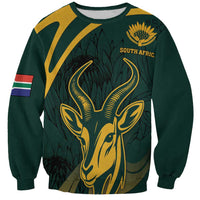 Green crewneck sweatshirt with gold springbok graphic and South Afric text