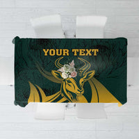 Green personalized tablecloth with gold antelope and dark leaf pattern