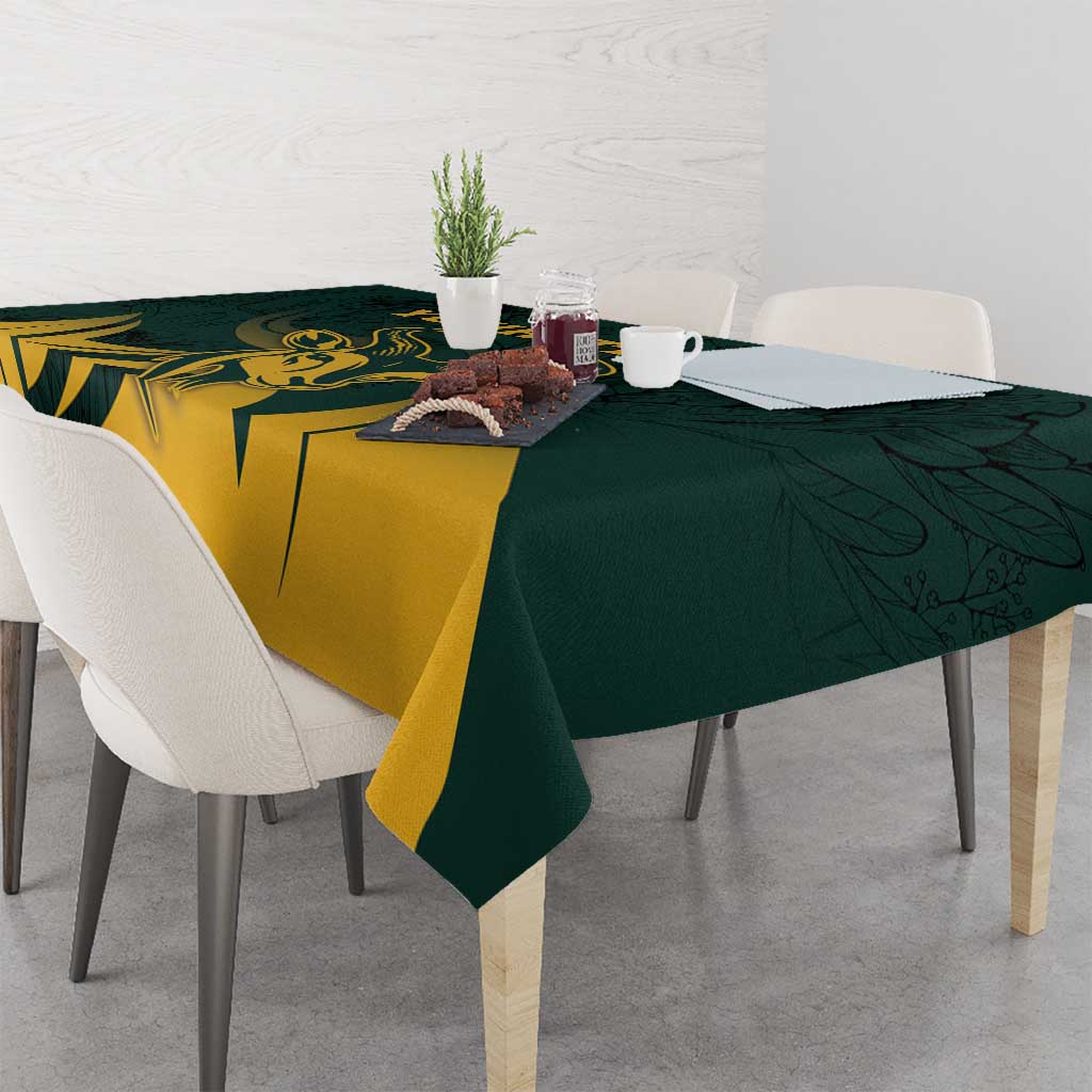 Green tablecloth corner view with gold antelope graphic and dark leaf print