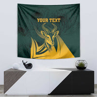 Green tapestry featuring gold springbok head, dark leaves, and centered editable text