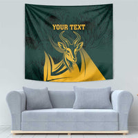 Green springbok wall tapestry with gold head emblem and leaf background, centered text
