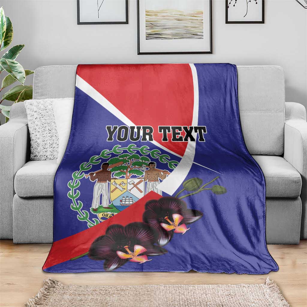 Blue Belize blanket on couch with coat of arms and orchid blossoms, 'YOUR TEXT'.