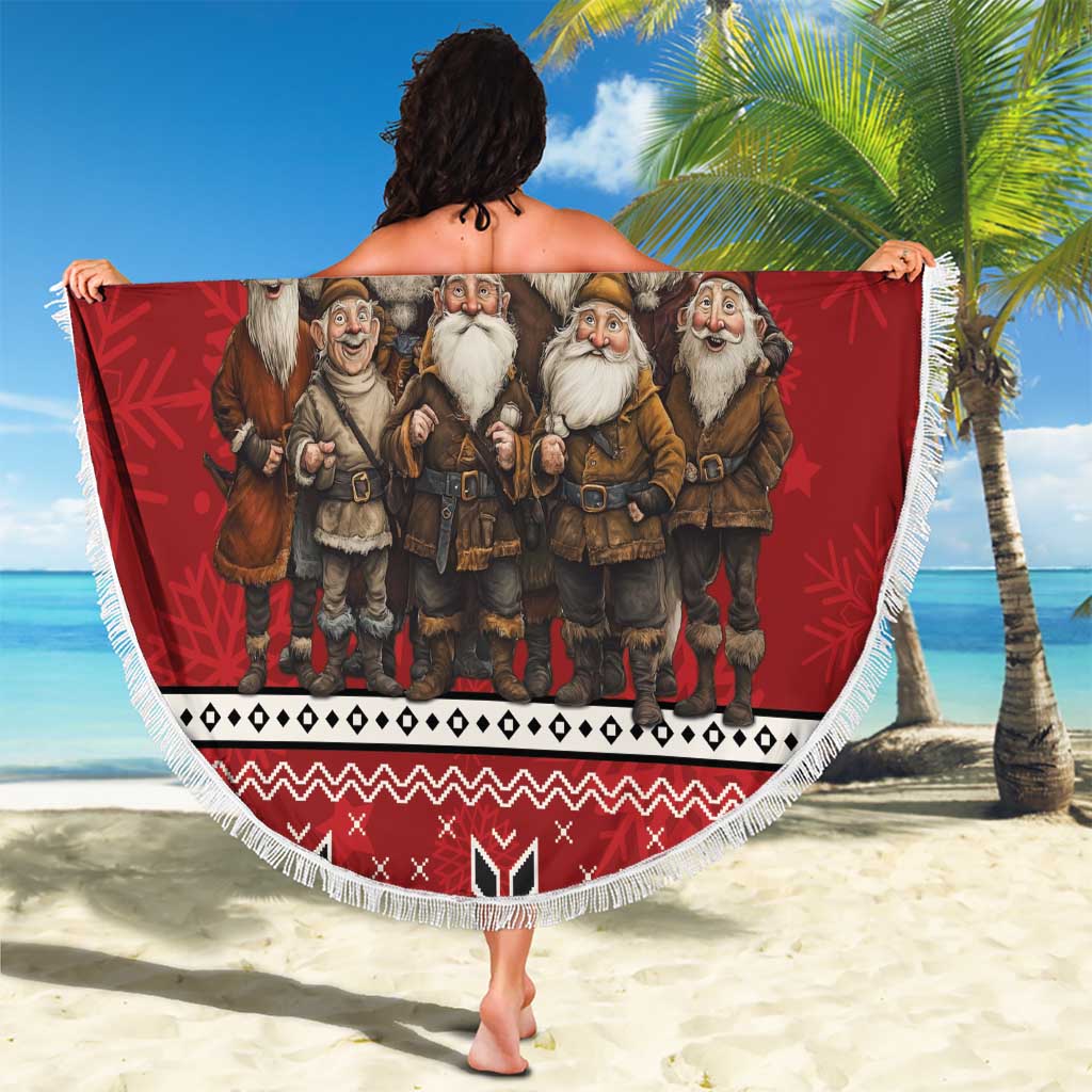 Red round beach blanket with fringe, Jolasveinaur gnome group design held up