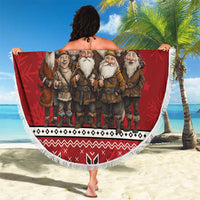 Red round beach blanket with fringe, Jolasveinaur gnome group design held up