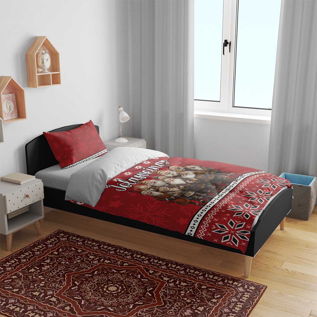 Red duvet and pillow shams with gnome artwork and Nordic snowflake geometric trim