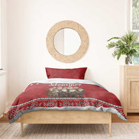 Red duvet with gnome group print and Nordic snowflake-and-star border