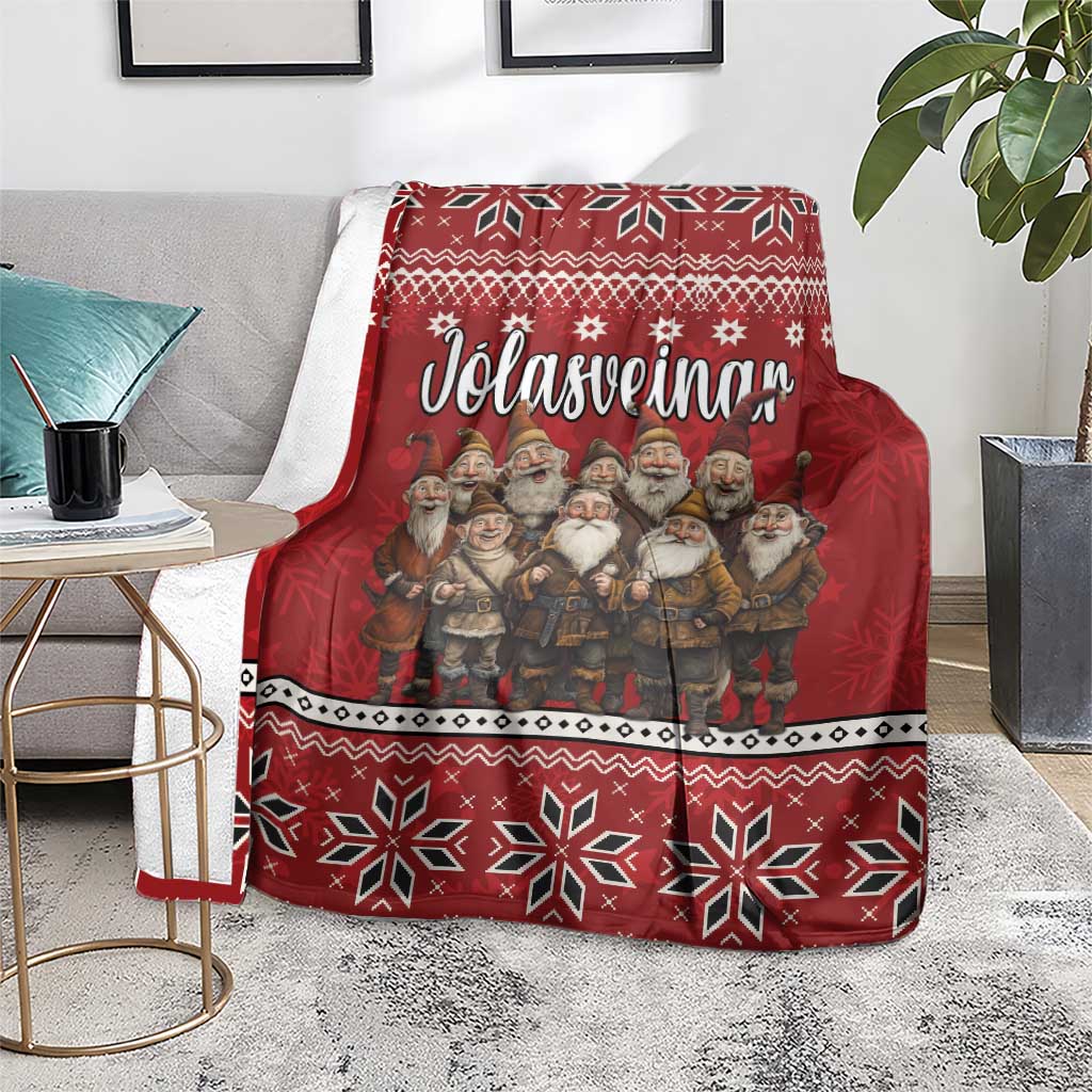 Red Christmas blanket with Yule Lads and Icelandic snowflake pattern