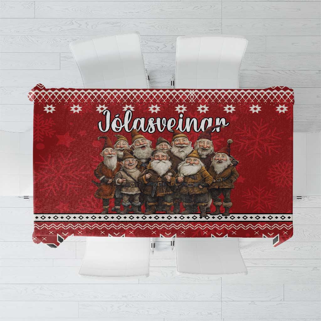 Red Christmas tablecloth with row of gnomes, snowflake motifs, and decorative border