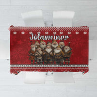Red Christmas tablecloth with row of gnomes, snowflake motifs, and decorative border