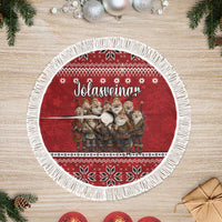 Red circular tree skirt with white fringe and elf-group graphic