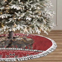 Red Christmas tree skirt with white fringe edge and central elf-group print