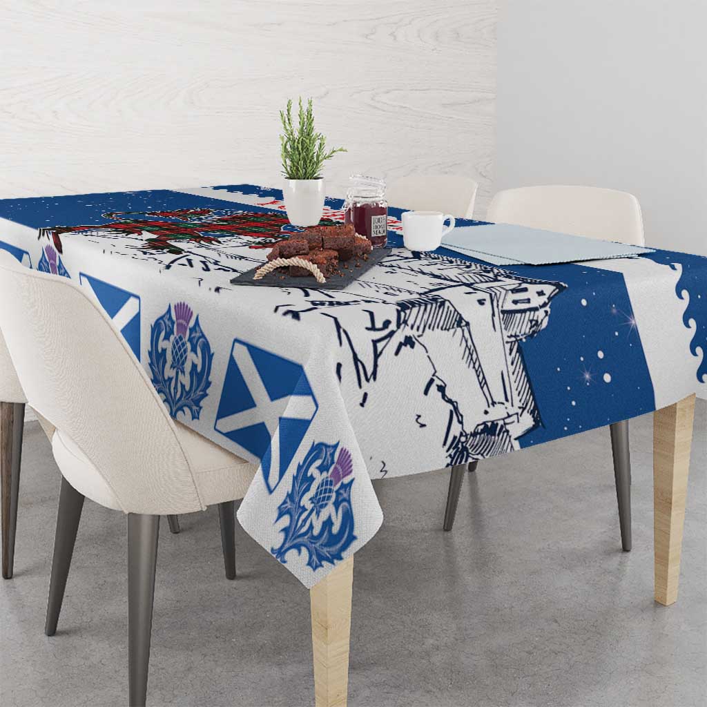 Blue holiday tablecloth draped on table, with crest and white X motifs