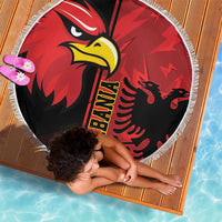 Round Albania eagle beach blanket in red and black with yellow text and fringed edge