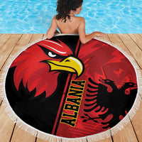 Round Albania eagle beach blanket in red and black with yellow beak and fringed border