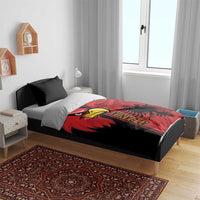 Eagle bedding set on bed: black and red duvet with “ALBANIA” eagle emblem, two black pillows