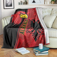 Red and black national emblem eagle grunge pattern blanket draped over sofa arm