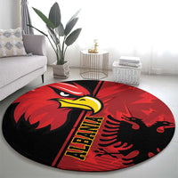 Round red eagle emblem rug with black background, yellow vertical lettering and red claws