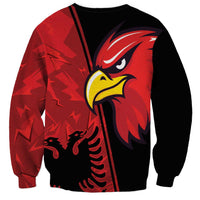 Red and black unisex sweatshirt with eagle head graphic and diagonal stripe panel