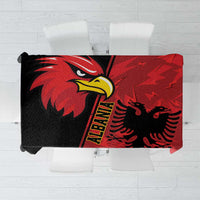 Red tablecloth with black eagle emblem and grunge pattern, folded over a table