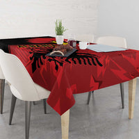 Red tablecloth with eagle emblem graphic and grunge texture, draped on table