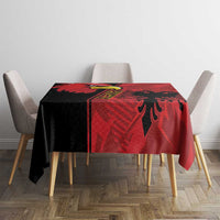 Red tablecloth with black eagle emblem, grunge pattern covering square dining table