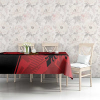 Red tablecloth with eagle emblem and grunge pattern, on dining table with chairs