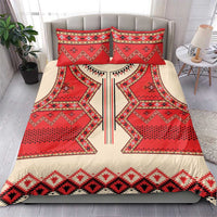 Bedding set on bed: red and cream folk geometric duvet with two matching decorative pillows