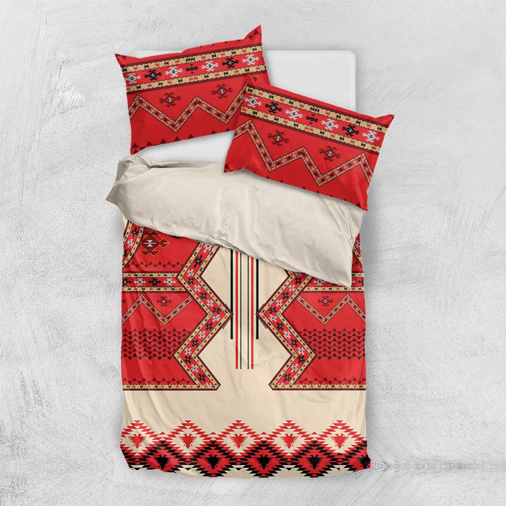Bedding set flat lay: red, cream, and black patterned duvet cover with two pillow cases