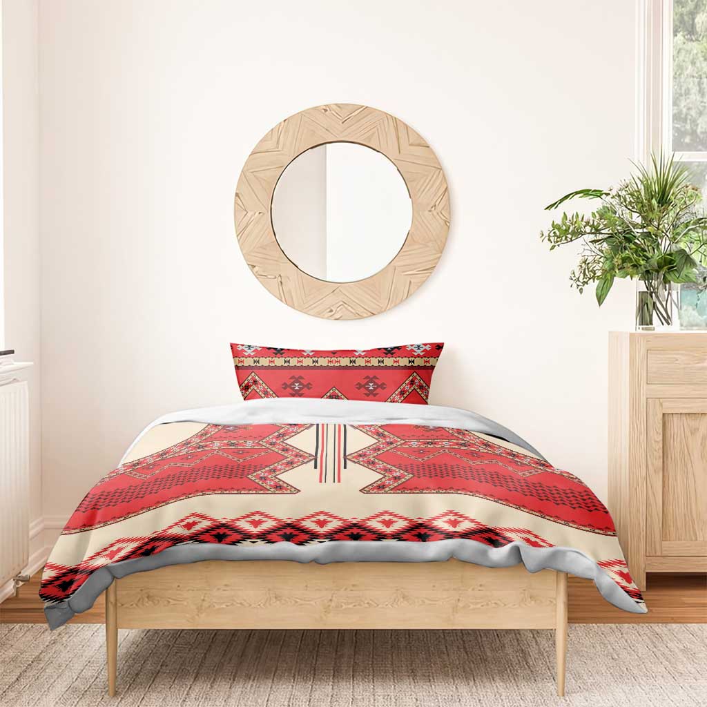 Bedding set on bed: red and cream folk geometric duvet with two pillow shams