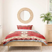 Bedding set on bed: red and cream folk geometric duvet with two pillow shams