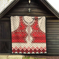 Beige quilt blanket with red eagle motif and black geometric border, quilted texture