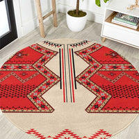 Round eagle motif carpet, beige base with red geometric panels and black stripe detail, LT18
