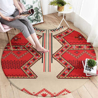 Round eagle motif carpet, beige base with red geometric panels and black stripe detail, LT18