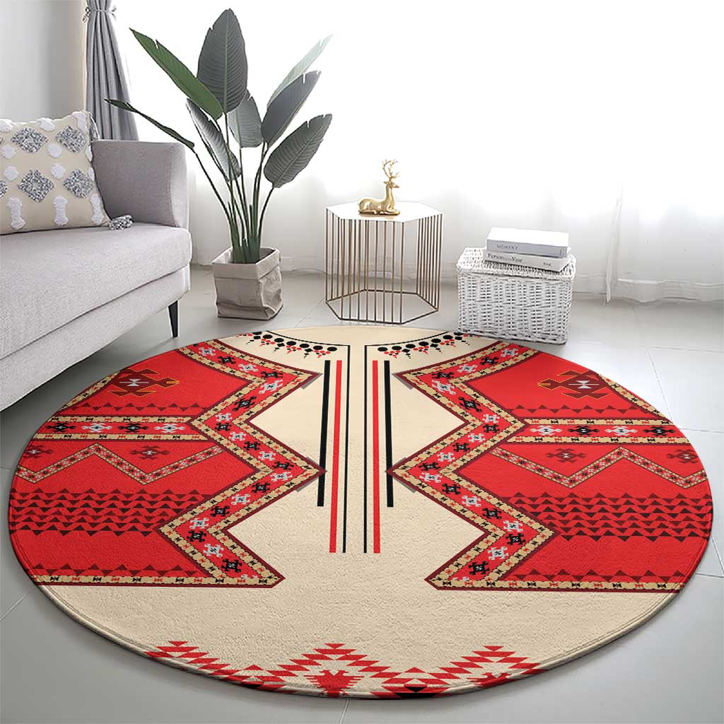 Round eagle motif carpet, beige with red diamond patterns and central striped band, LT18