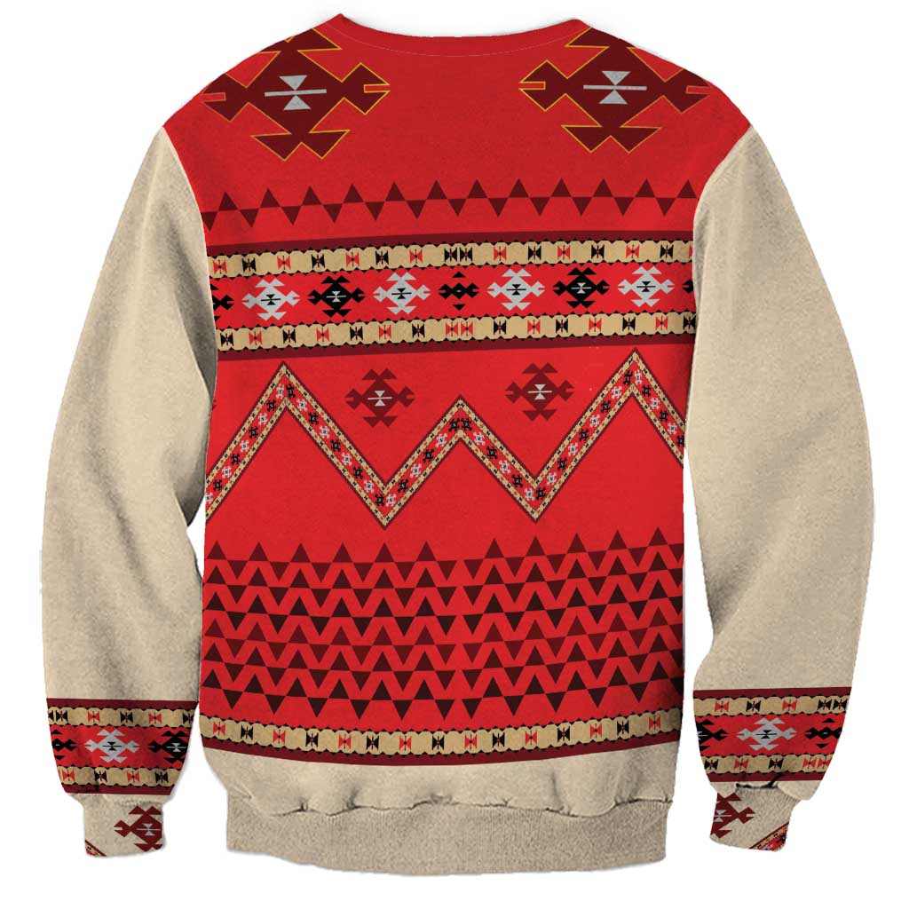 Beige crewneck sweatshirt with red folk patterns, zigzag bands, and striped hem cuffs