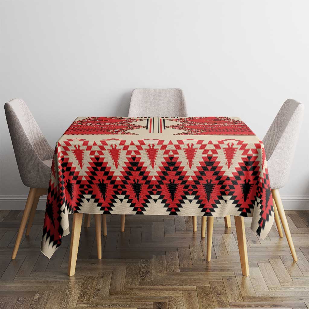 Beige round tablecloth with red, white, and black patterned surface
