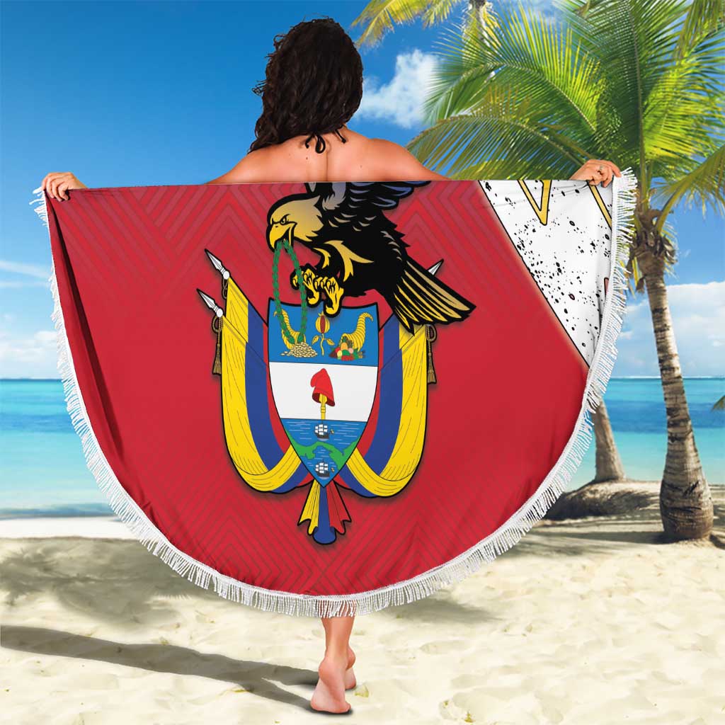Round beach blanket with fringe, large coat-of-arms graphic in red, yellow, and navy