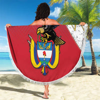 Round beach blanket with fringe, large coat-of-arms graphic in red, yellow, and navy